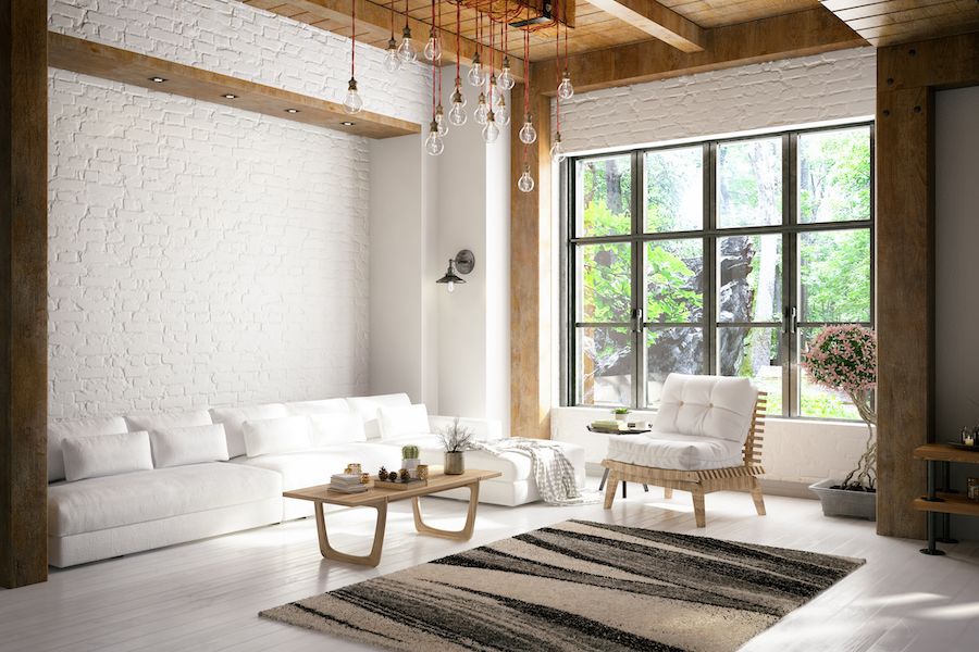 Image of a living room with white walls and lights dangling from the ceiling. Improve Your Home's Indoor Air Quality.